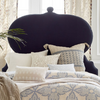 A bed with a Custom Orissa headboard and pillows by John Robshaw available for Free Shipping.