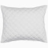 A John Robshaw Layla White Quilt on a cotton voile background.