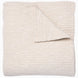 A Vivada Sand Woven Quilt, hand-stitched quilt, by John Robshaw.