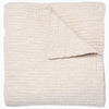 A Vivada Sand Woven Quilt, hand-stitched quilt, by John Robshaw.