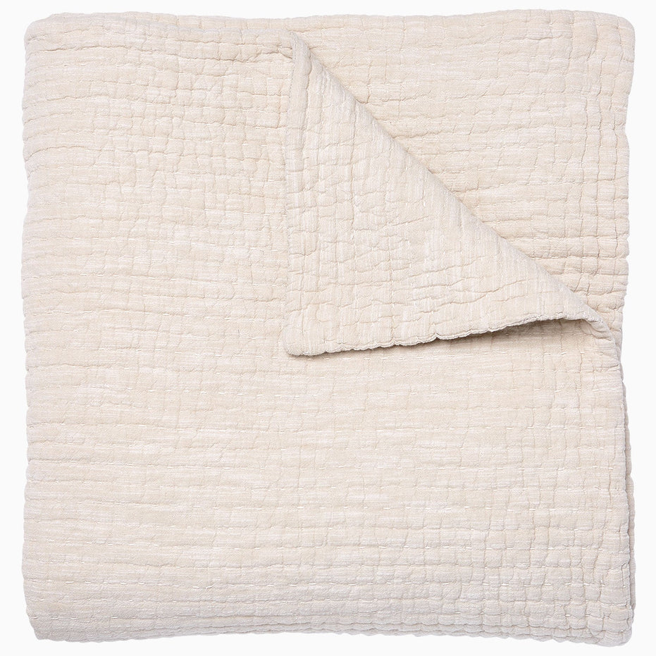A Vivada Sand Woven Quilt, hand-stitched quilt, by John Robshaw.