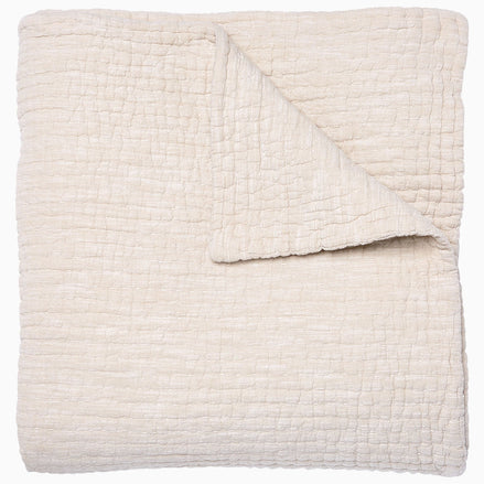 A Vivada Sand Woven Quilt, hand-stitched quilt, by John Robshaw.