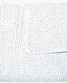 A white Organic Hand Stitched Light Indigo Quilt with blue dots on it, made with hand stitching and cotton voile, by John Robshaw.
