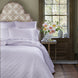 A Nandi Lavender Quilted bed with John Robshaw lavender pillows.
