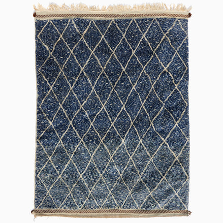 Blue Village 2 Wool Rug: a blue rectangular handwoven Moroccan rug with a white lattice design and fringed ends.