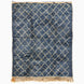Blue Village Wool Rug with a white diamond pattern, rectangular shape, and fringed ends.