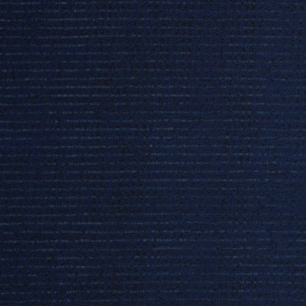 Close-up of dark blue woven fabric, specifically the Bijal Indigo Performance Fabric featured on the Round Swivel Chair by John Robshaw, showing a detailed textured pattern with visible horizontal and vertical threads intersecting throughout the surface.