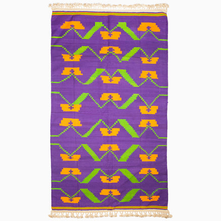 A Purple Orange Murmur Rug from John Robshaw, with a unique design, showcasing vibrant purple and orange hues.