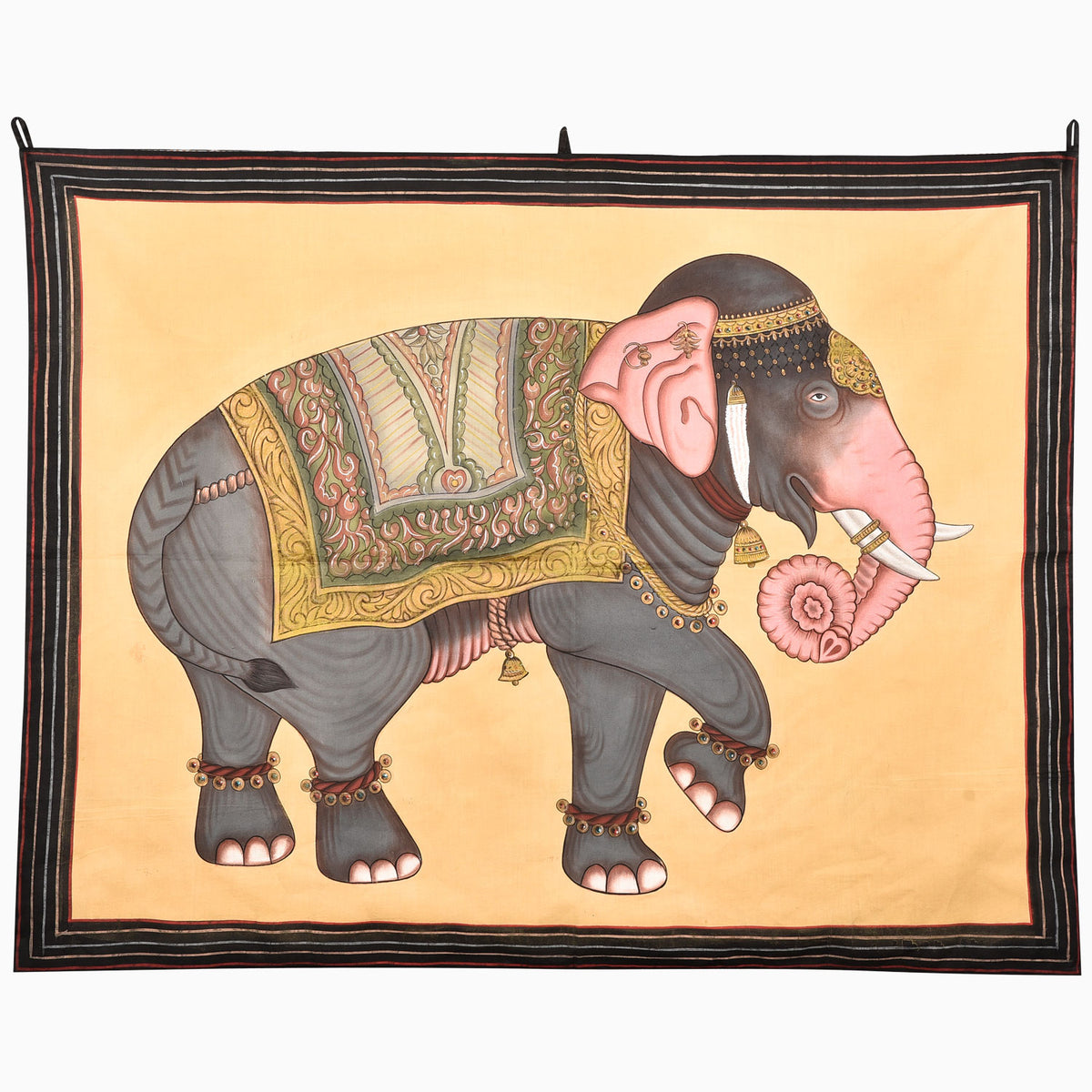 John Robshaw Elephant Tromping Tapestry featuring a hand-painted elephant in traditional Rajasthan style, complete with an ornate saddle, headpiece, and ankle bells.