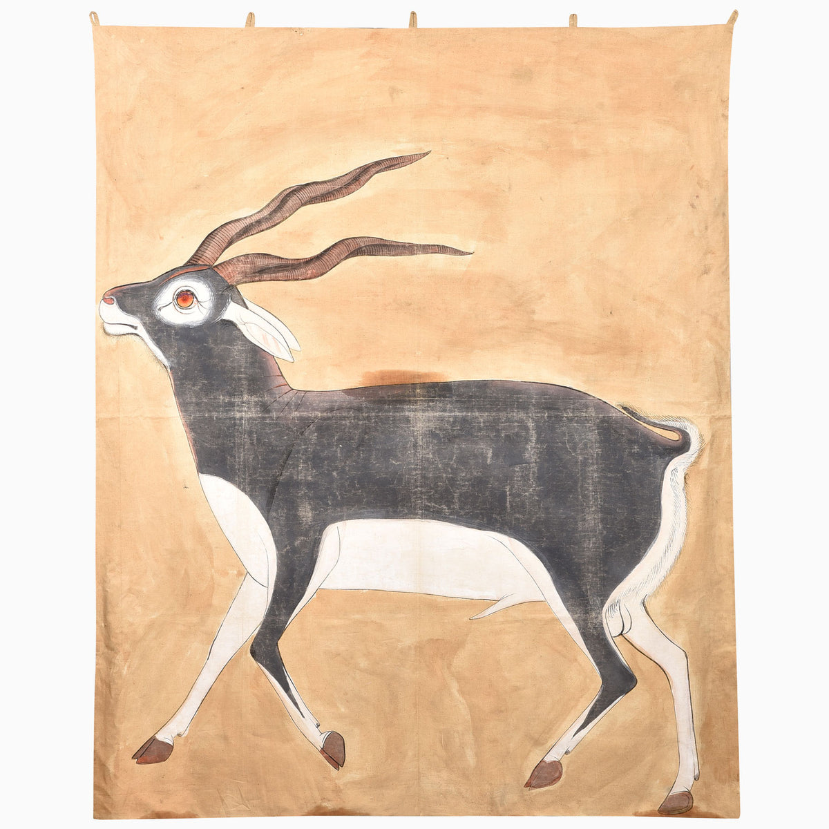 John Robshaw Thinking Ram tapestry featuring a hand-painted blackbuck antelope with long, spiraled horns against a tan background.
