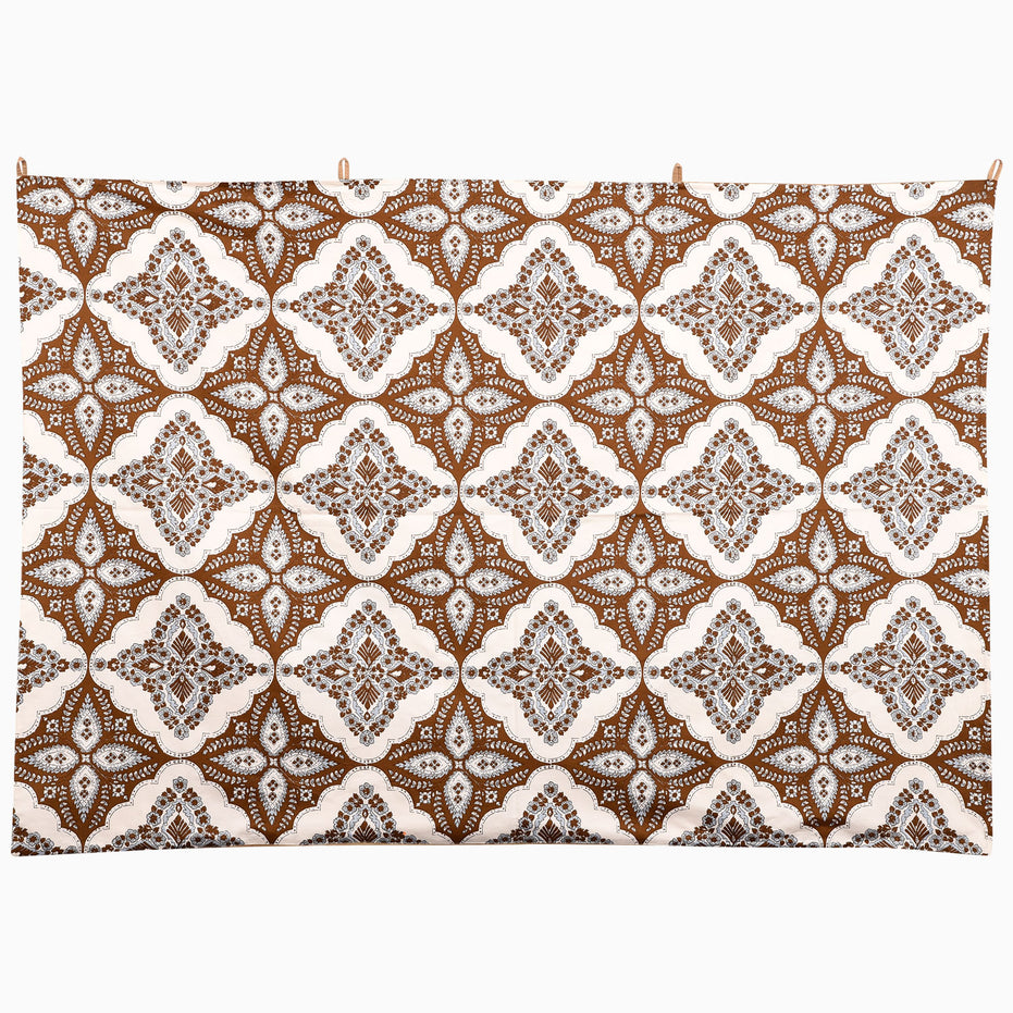 John Robshaw On the Move Again Tapestry, a rectangular wall hanging featuring a hand-painted floral lattice pattern in brown and white.