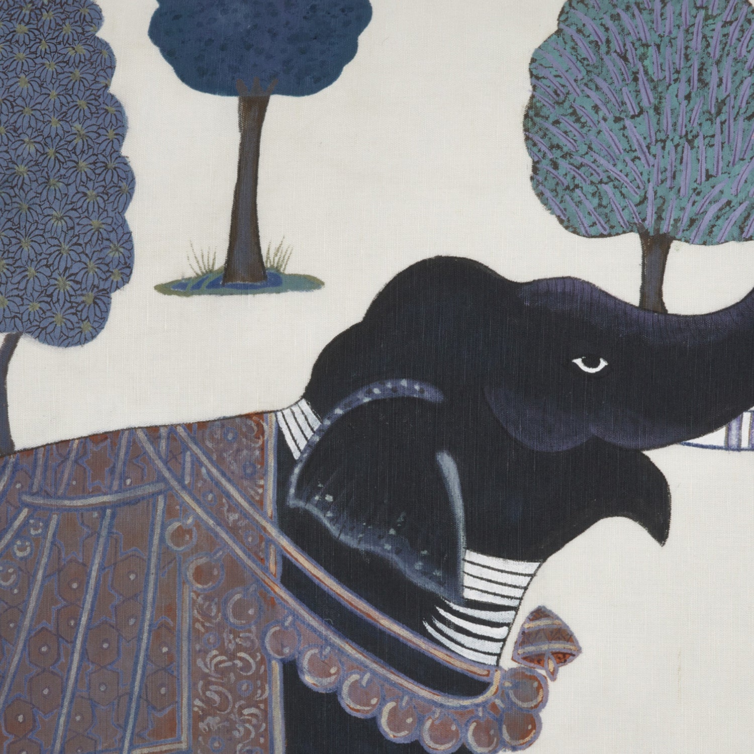 A hand painted Indigo Elephant decorative pillow, depicted on cotton linen, by John Robshaw.