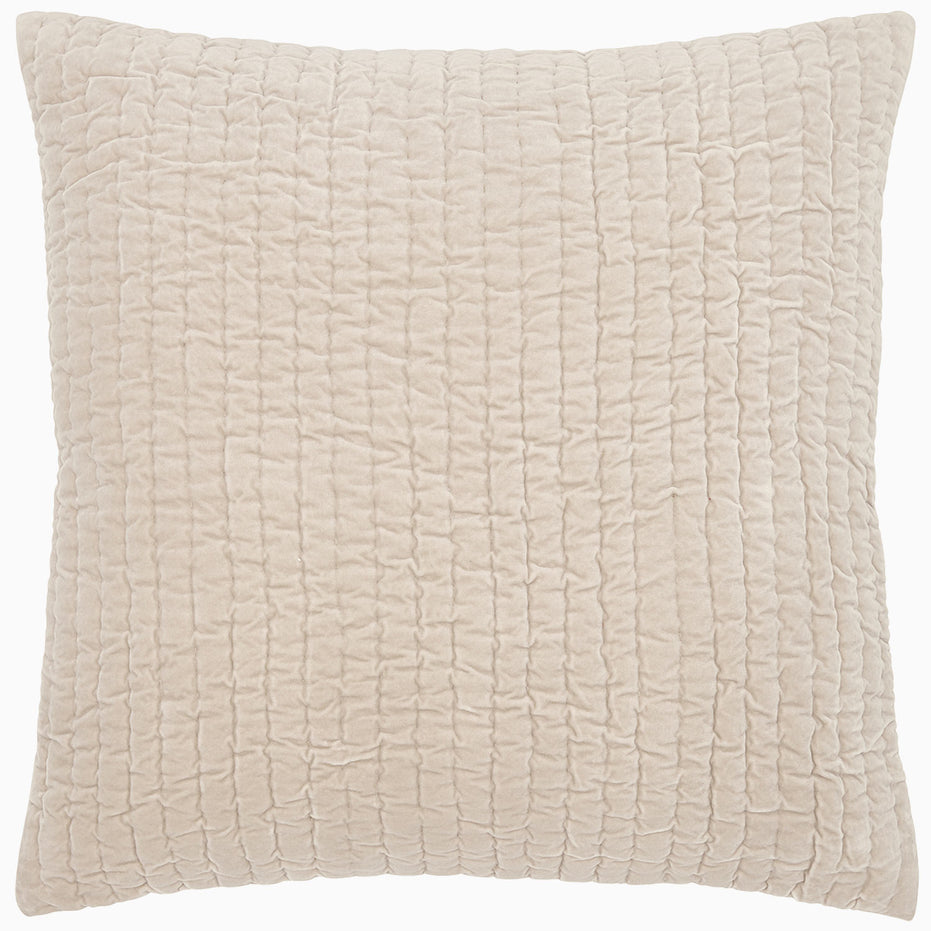 A soft, beige John Robshaw Velvet Sand Quilted pillow on a white background.