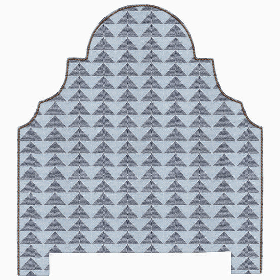 A Custom Dara Headboard with a geometric pattern in blue and gray available for shipping by John Robshaw.