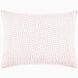 A John Robshaw Organic Hand Stitched Lotus Quilt with a pink and white pillow with dots on an organic cotton voile coverlet.