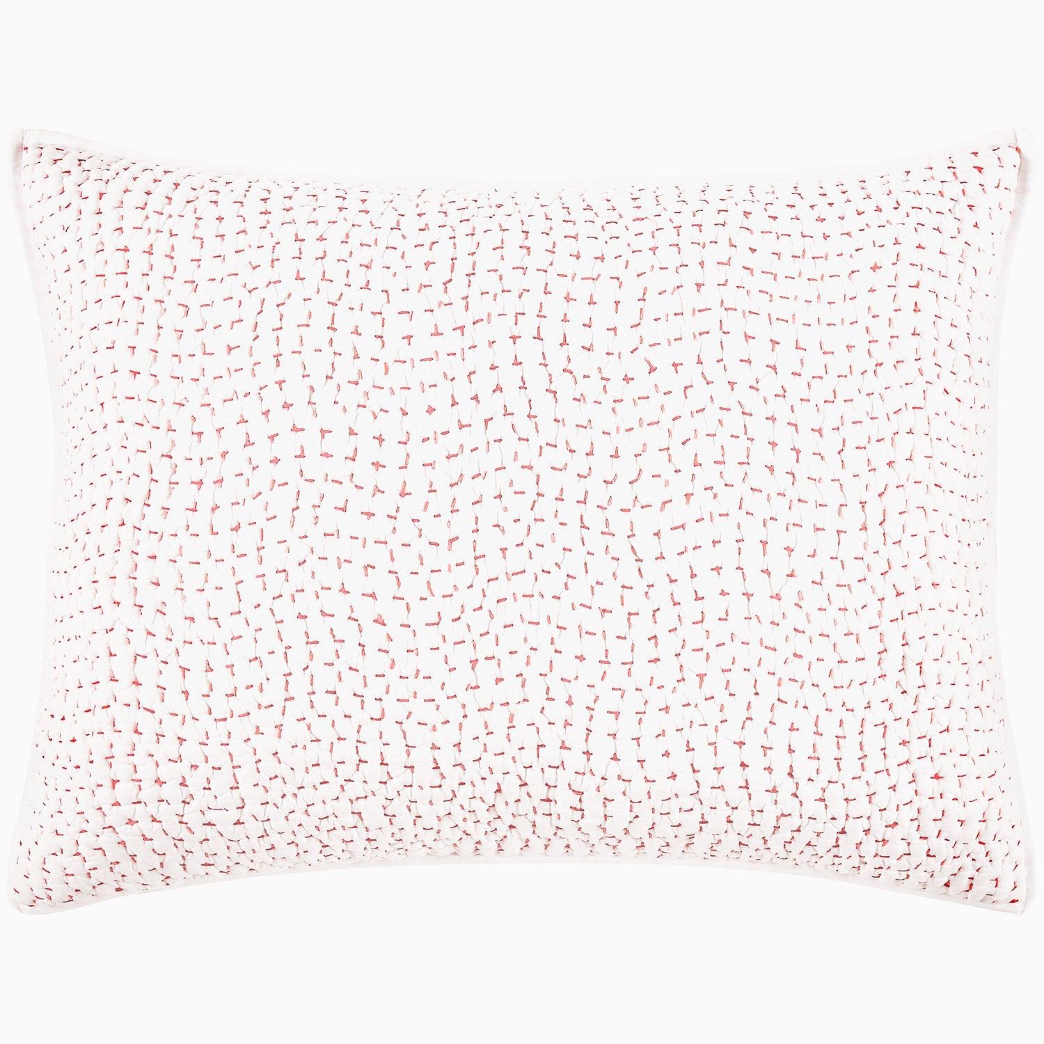 A John Robshaw Organic Hand Stitched Lotus Quilt with a pink and white pillow with dots on an organic cotton voile coverlet.