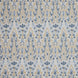 A blue and yellow floral pattern on a white background inspired by the Mughal gardens of Shalimar Bagh, featuring the Marmar Marigold Performance Fabric by John Robshaw.