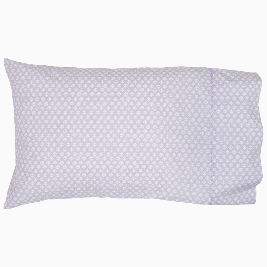 A Bindi Lavender Organic Sheet Set with a lavender and white polka dot pattern, designed by John Robshaw.