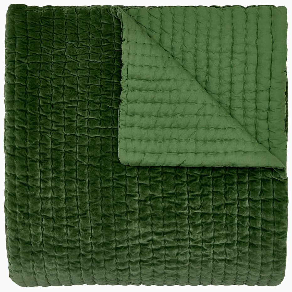 A Velvet Moss Quilt by John Robshaw, handcrafted by Indian artisans, on a white background.
