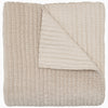 A soft, beige Velvet Sand Quilt by John Robshaw.