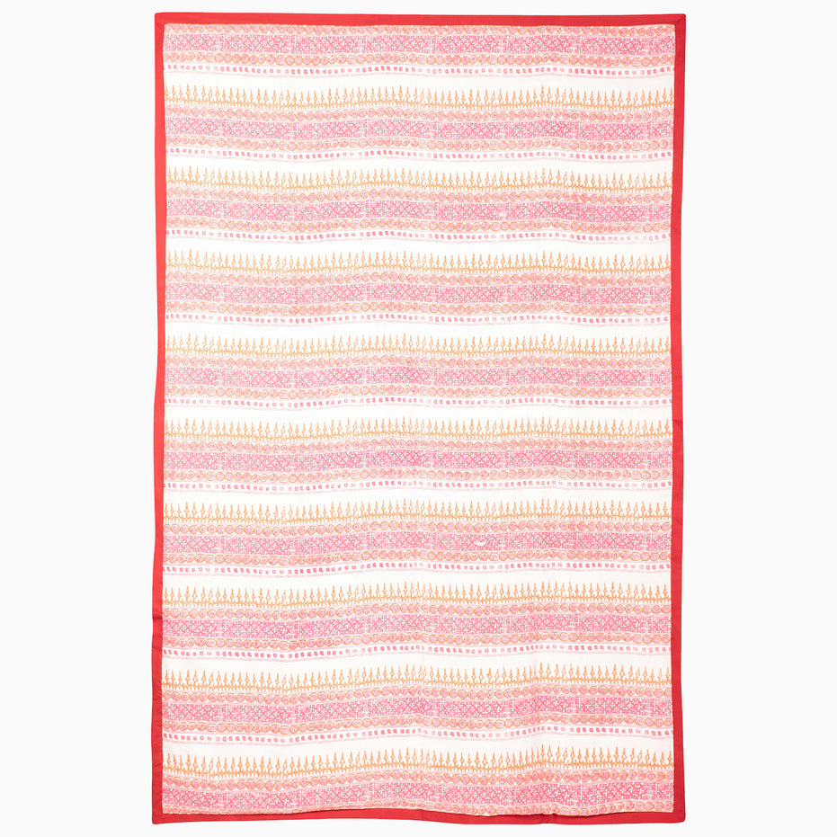 Rectangular Harvest Poppy Suzani Blanket by John Robshaw featuring horizontal stripes of pink and orange floral and geometric patterns, finished with a solid red border.