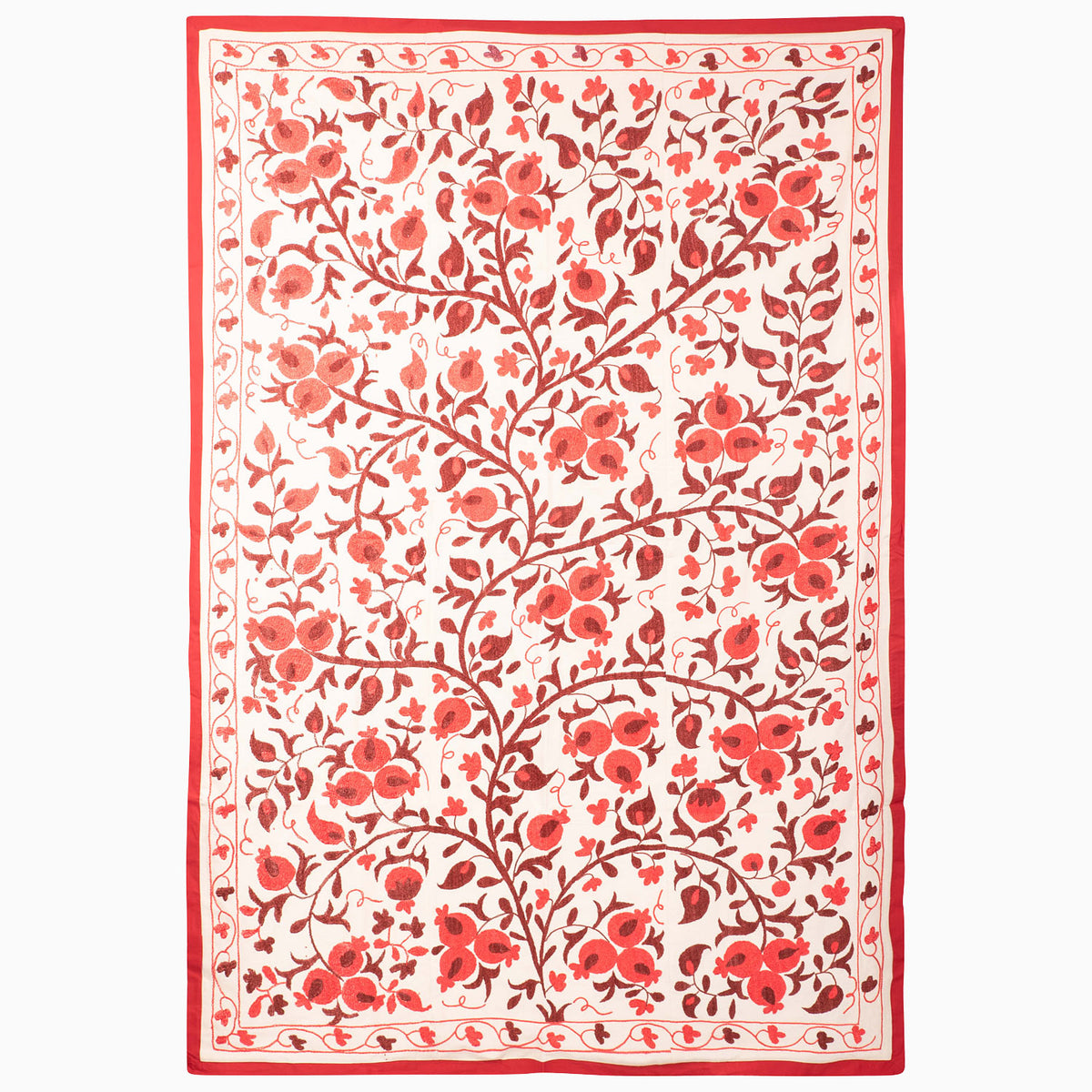 John Robshaw Harvest Poppy Suzani blanket in a rectangular, vintage style with a red-and-white botanical pattern of scrolling pomegranate vines and flowers enclosed by a solid red border.