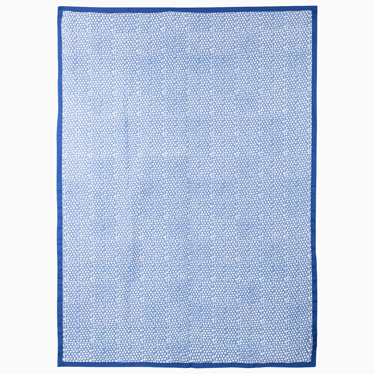 John Robshaw Indigo Sky Suzani Blanket in a rectangular hand block printed design with a blue and white geometric grid pattern and a solid blue border.