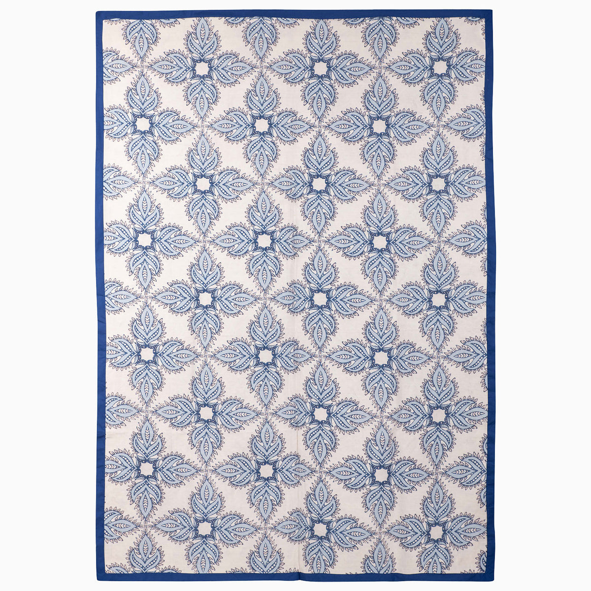 John Robshaw Open Water Suzani Blanket with a vintage pattern of blue and white floral medallions and a solid indigo border.