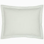 A John Robshaw Cinde Sage Organic Duvet with a green polka dot pillowcase.