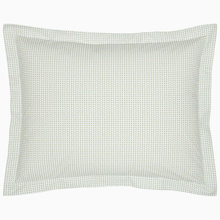 A John Robshaw Cinde Sage Organic Duvet with a green polka dot pillowcase.