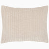 A soft beige Velvet Sand Quilt pillow, hand quilted by John Robshaw.