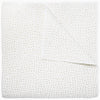 A white cotton voile coverlet featuring John Robshaw's Organic Hand Stitched Sand Quilt with subtle white dot patterns.