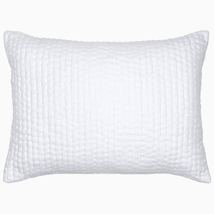 A Vivada White Woven Quilt pillow with hand stitching by John Robshaw.