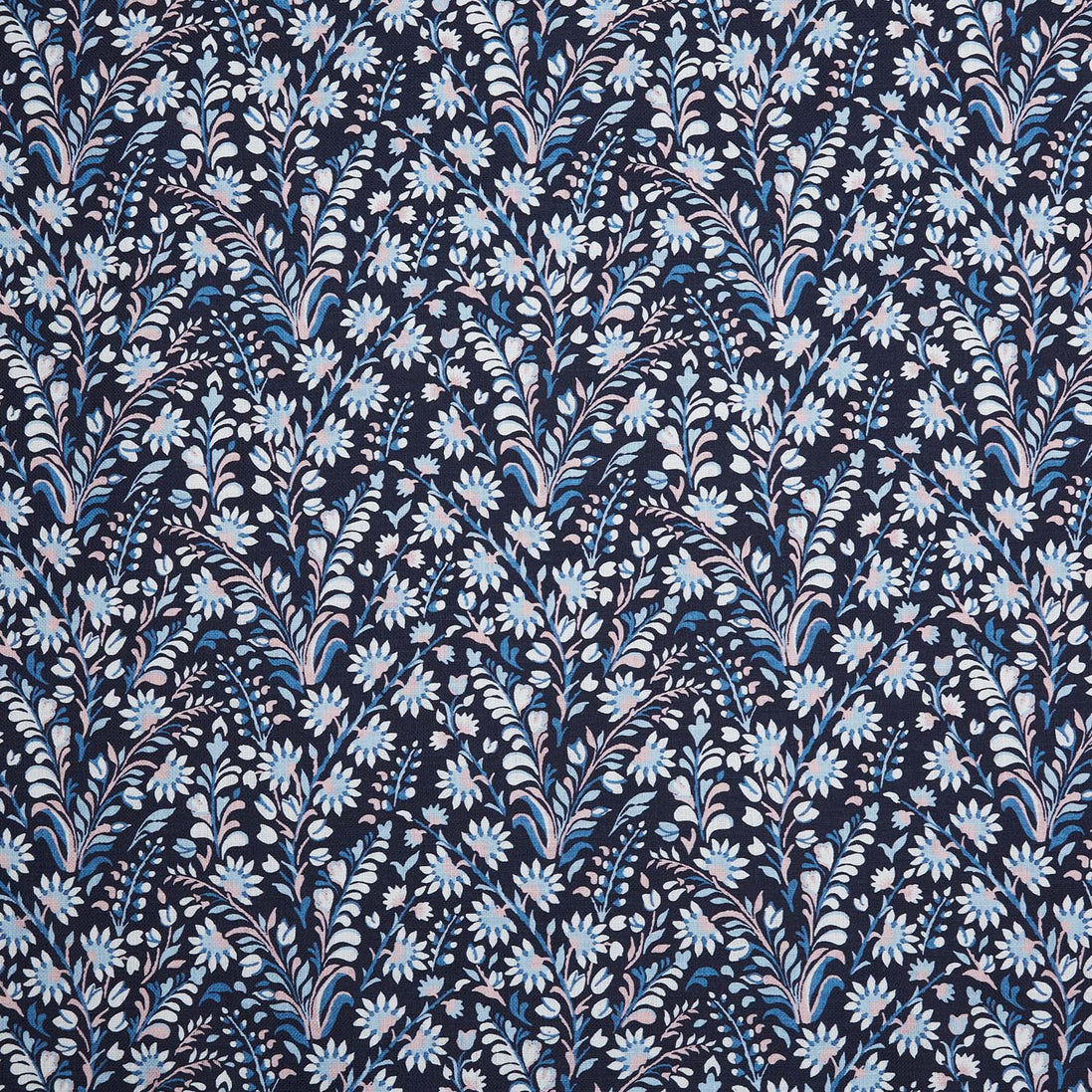 A Valli Indigo Fabric by John Robshaw, a blue and white floral printed fabric known for its handmade quality.