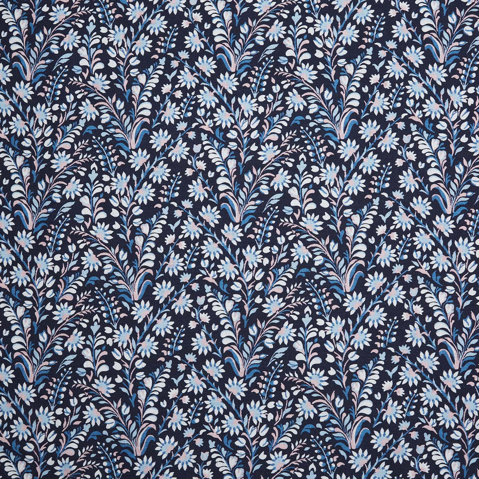 A Valli Indigo Fabric by John Robshaw, a blue and white floral printed fabric known for its handmade quality.
