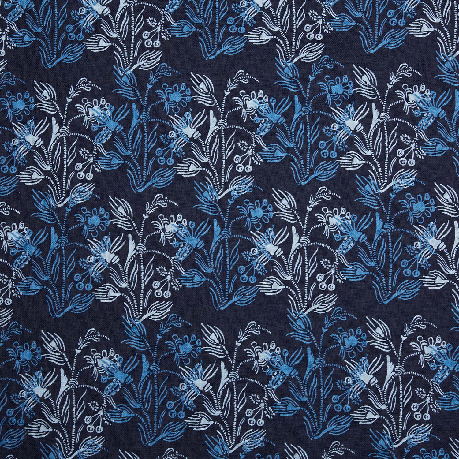 An Ananya Indigo fabric, hand-printed with blue and white floral design, by John Robshaw.