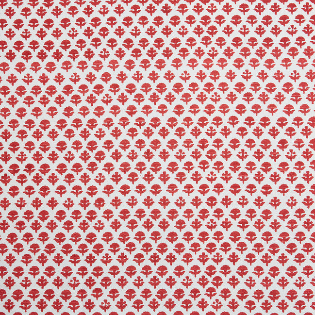 A red and white pattern on a white background, featuring traditional craftsmanship, with the Bindi Coral Fabric by John Robshaw.