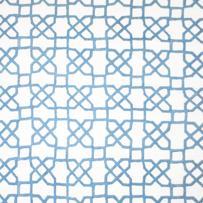 A blue and white pattern adorned with Mughal motifs on a white background, expertly crafted using traditional techniques of hand block printing, featuring the Citadel Light Indigo Fabric by John Robshaw.