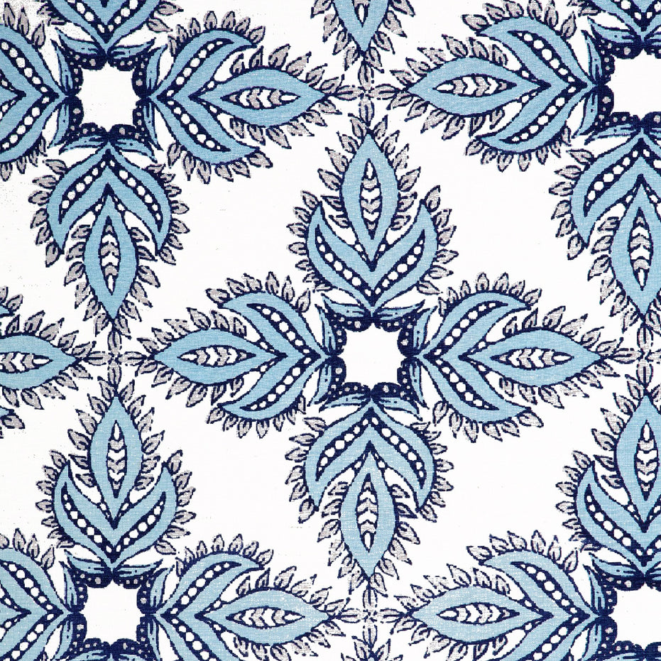 A Diba Light Indigo Fabric by John Robshaw, hand block printed with a blue and white paisley pattern, featuring the protective symbol of nazar.