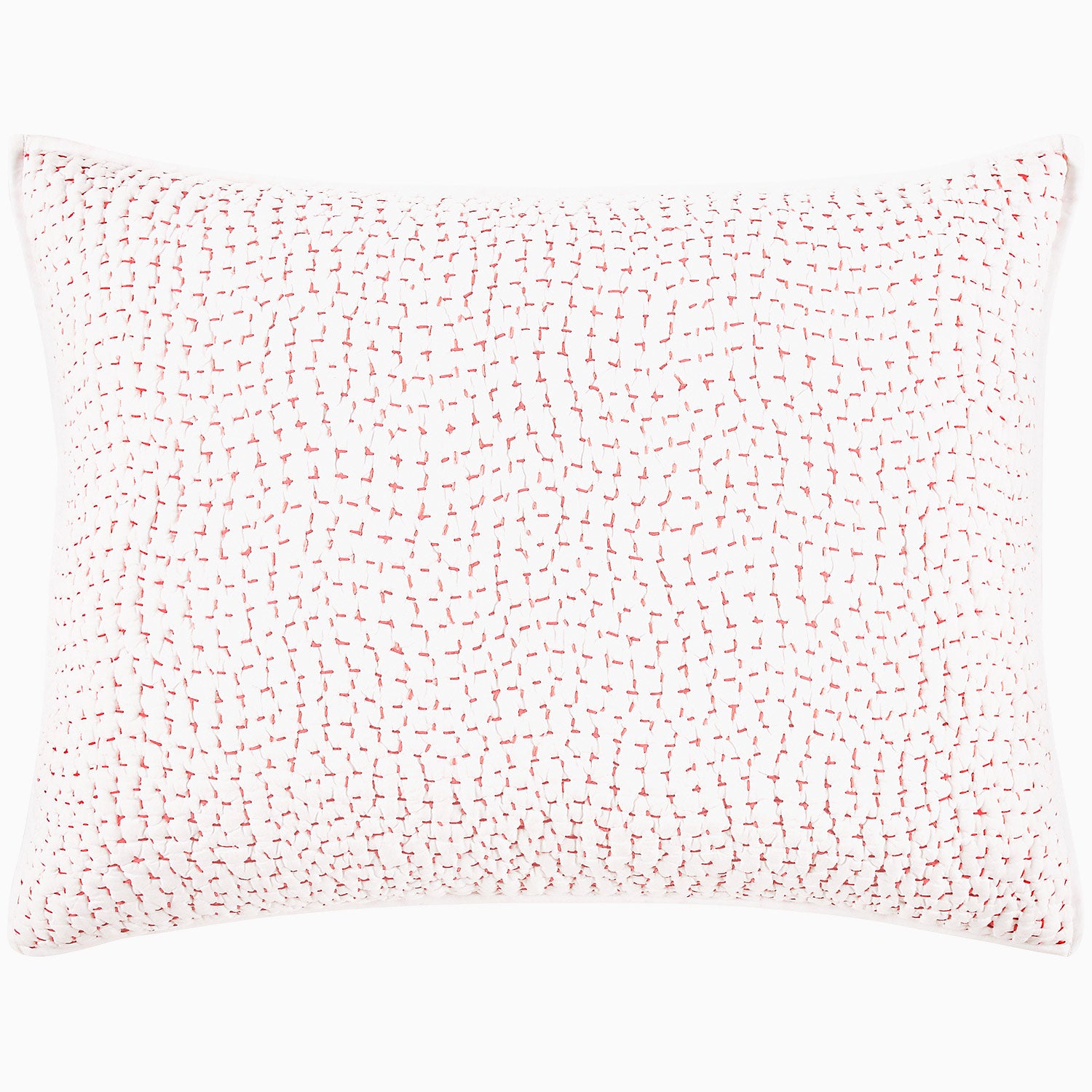 A John Robshaw Organic Hand Stitched Lotus Quilt with a pink and white pillow with dots on an organic cotton voile coverlet.