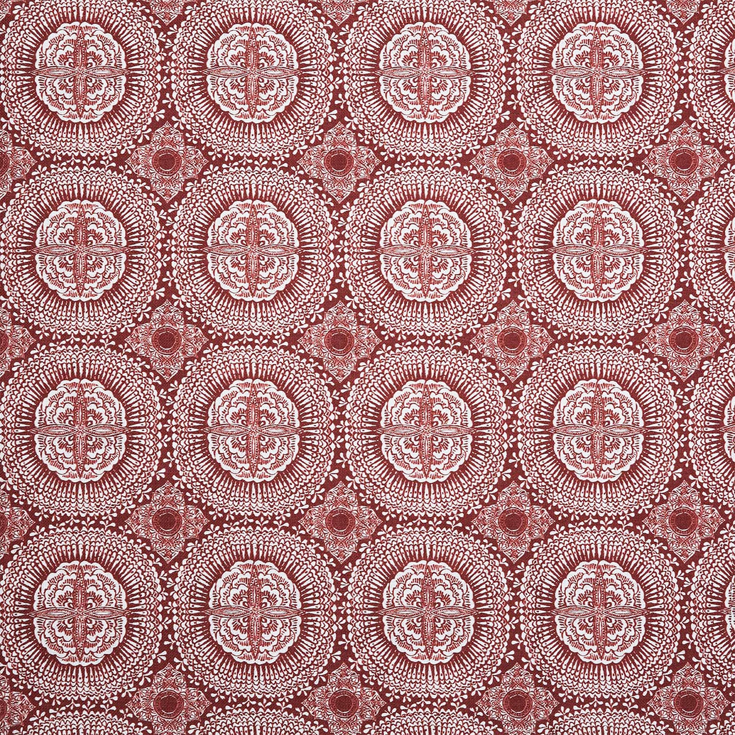 A red and white block print pattern on Kala Teak fabric by John Robshaw.