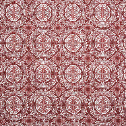 A red and white block print pattern on Kala Teak fabric by John Robshaw.