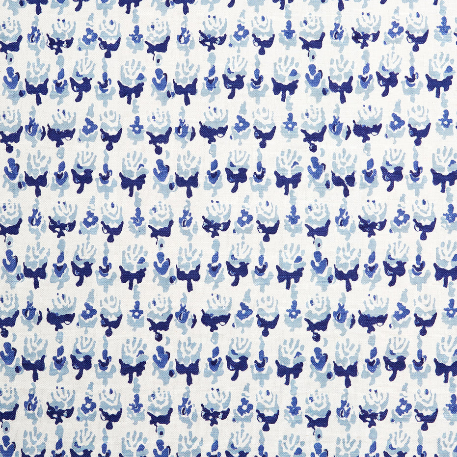 A blue and white wax print pattern on a Kiki Turquoise Fabric hand block printed by John Robshaw.