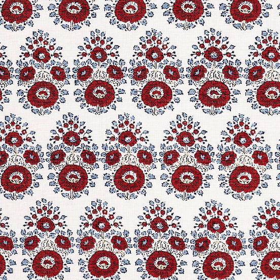 A hand block printed Lanka Coral Fabric with a red and blue paisley pattern on a white background, showcasing traditional craftsmanship, from the brand John Robshaw.