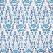 A hand block printed Marmar Turquoise Fabric with a blue and white floral pattern on a crisp white background, inspired by the stunning Mughal gardens in India, created by John Robshaw.