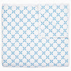 A Layla Azure Quilt by John Robshaw, a cotton voile blue and white blanket with a geometric pattern inspired by Mughal gardens.