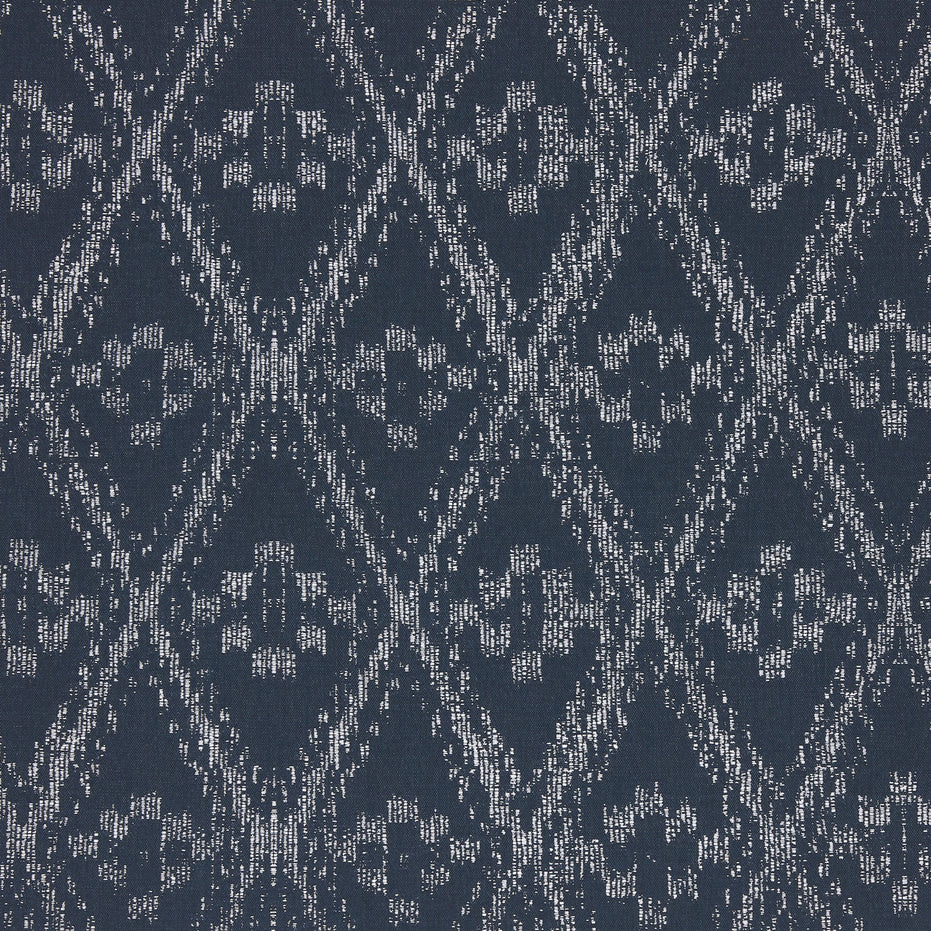 A blue and white Ramati Azure Performance Fabric with a diamond pattern, inspired by Thai ikats, by John Robshaw.