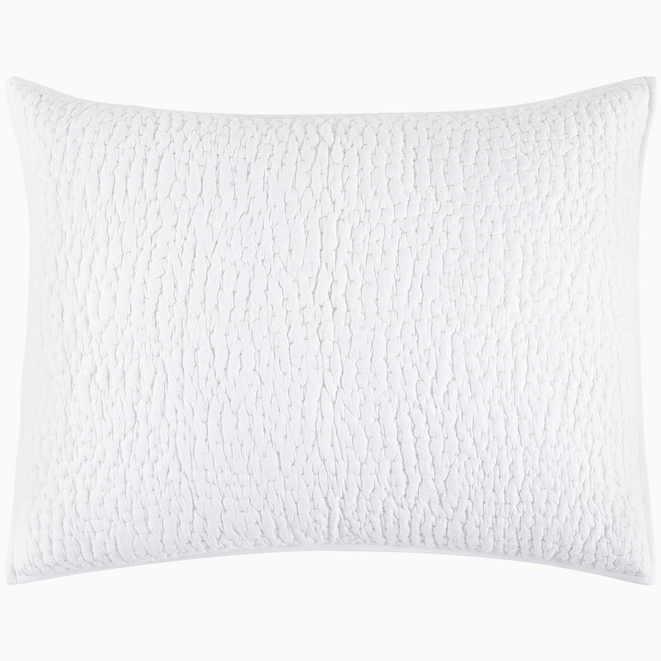 An Organic Hand Stitched White Quilt from John Robshaw with a cotton voile coverlet on a white background.