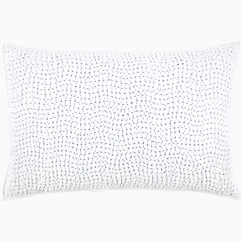 A John Robshaw Organic Hand Stitched Light Indigo Quilt with blue dots.