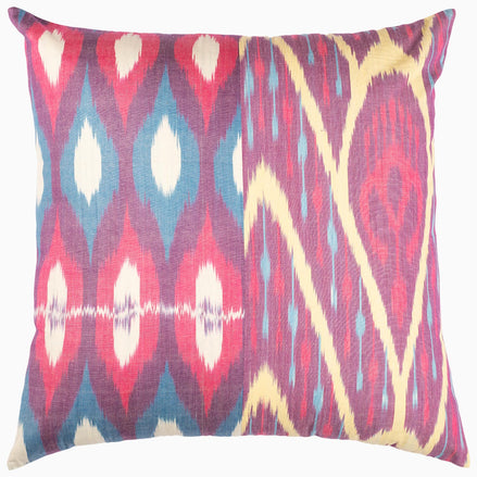 A Diamond Octagon Ikat Pillow by John Robshaw with a pink, blue and yellow design.